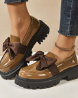 Chique, zoete platform loafers met strik